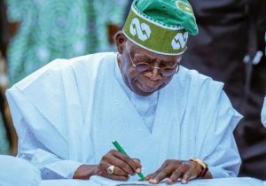 Tinubu-signs-486x340-1